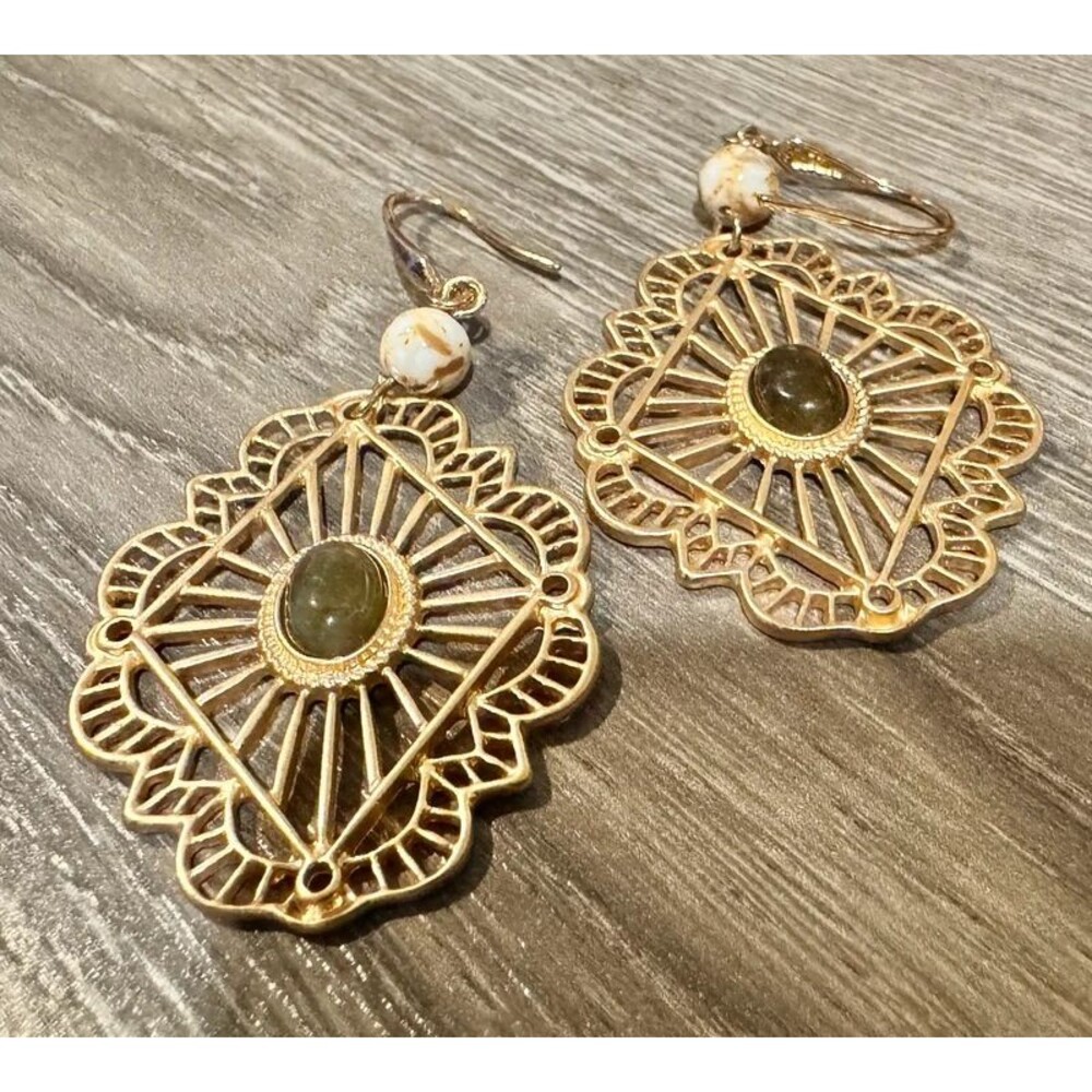 Brass tone earrings with middle stone bead